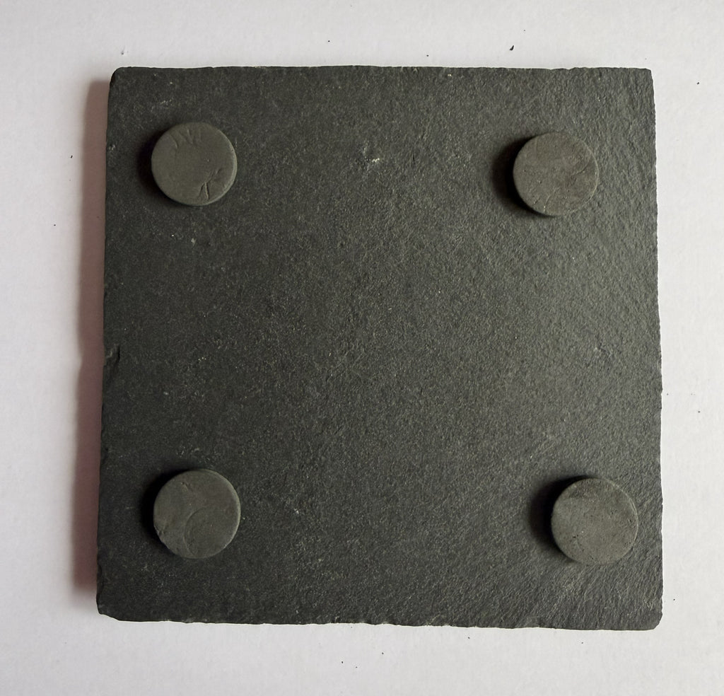 Slate coaster base showing four rubber non-slip feet