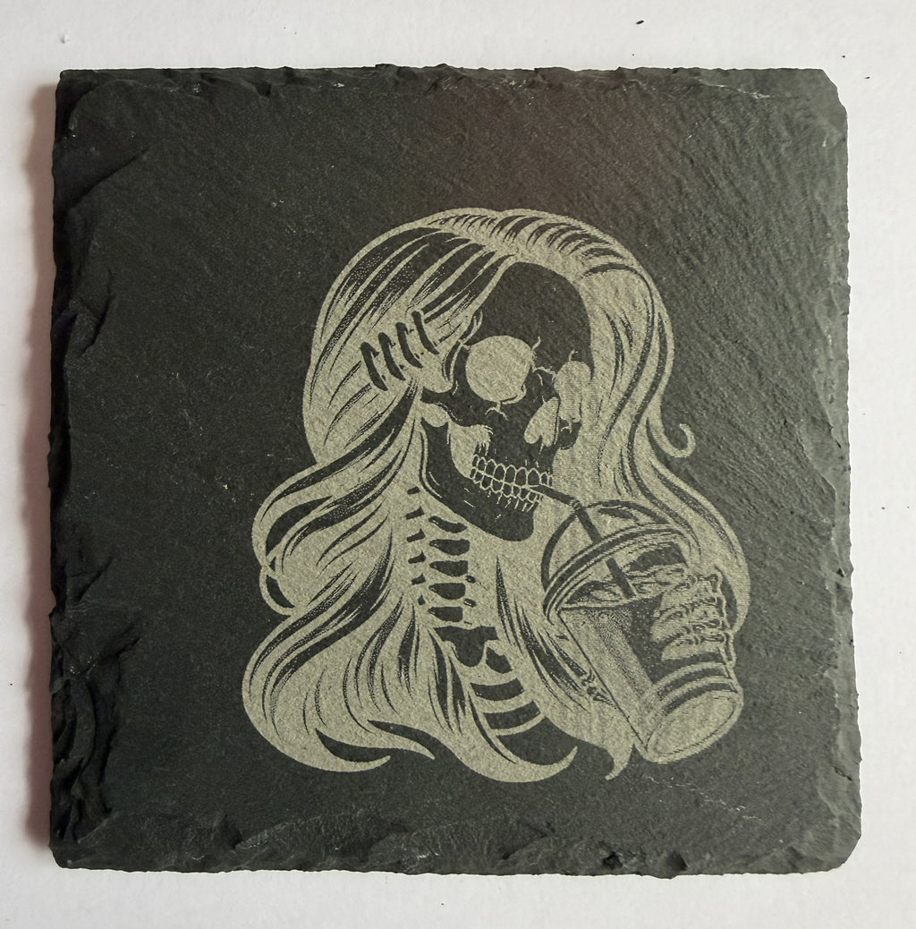 Skeleton girl with iced coffee laser engraved slate coaster front