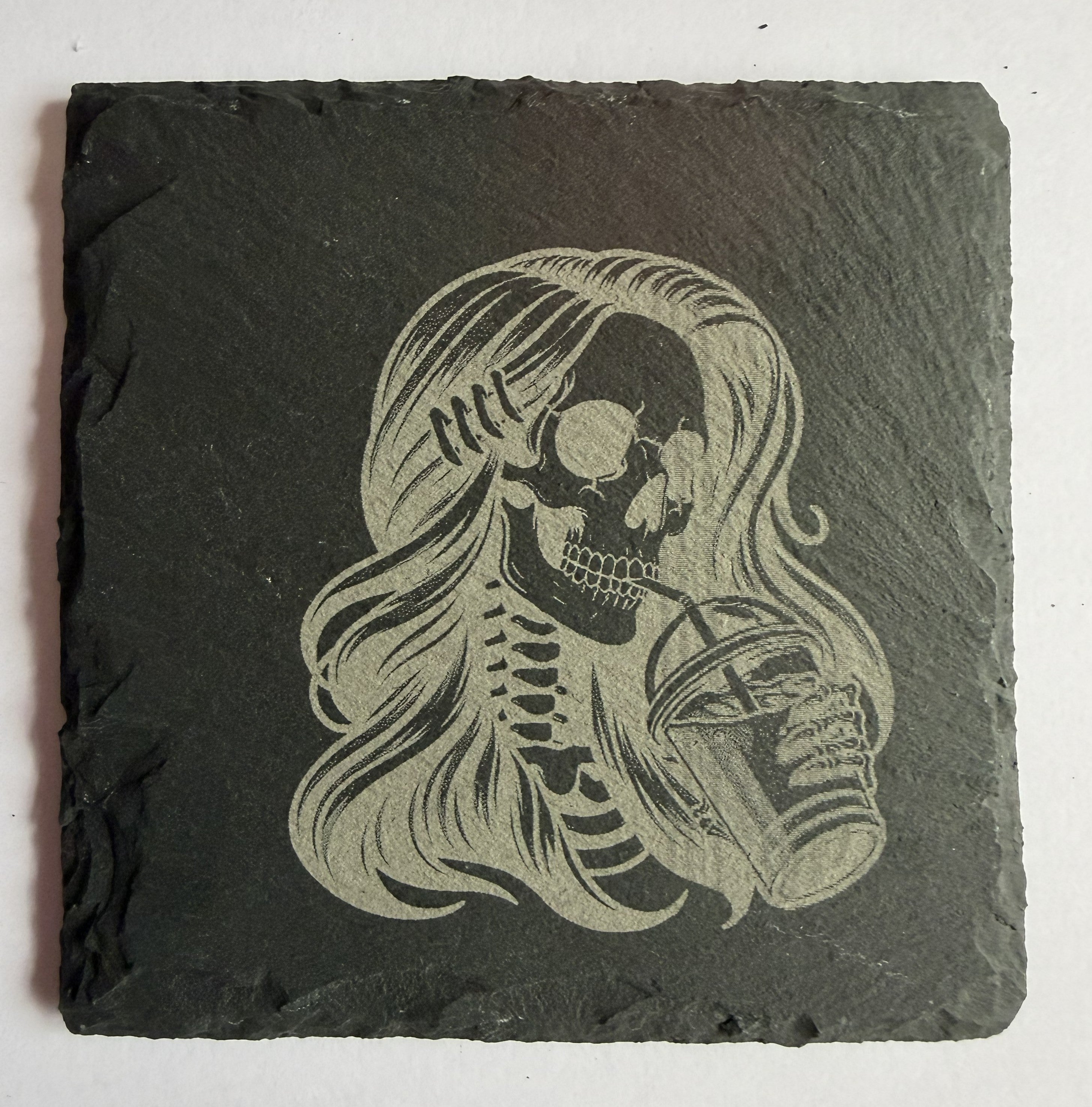 Skeleton girl with iced coffee laser engraved slate coaster front