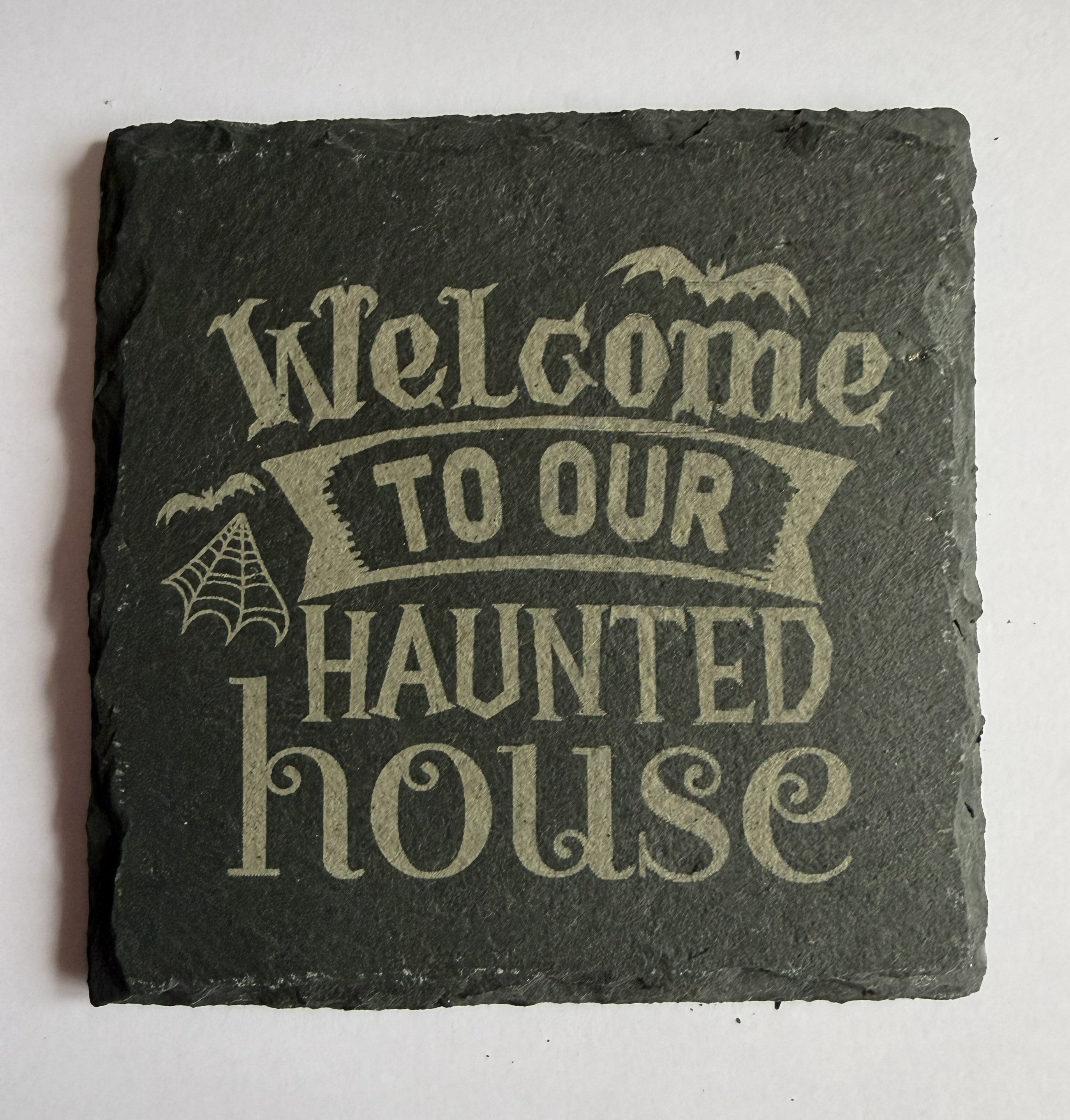 Welcome to Our Haunted House laser engraved slate coaster